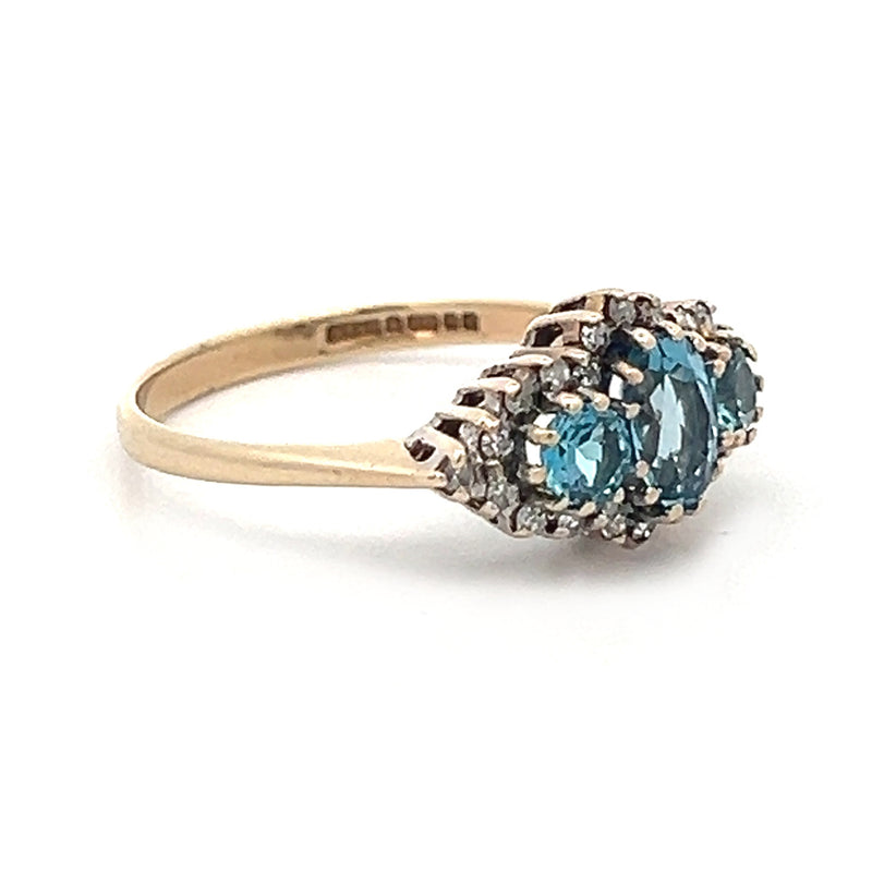 Pre Owned Blue Topaz & Diamond Trilogy Ring 9ct Gold SIDE